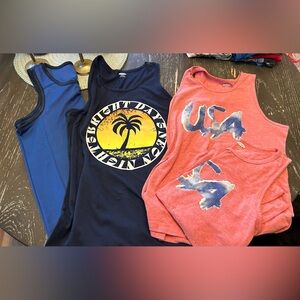Set of 4.    Kids Size Large, 10/12 tank tops. Each one only worn once.